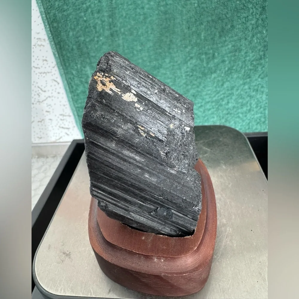 Black tourmaline on wooden stand base